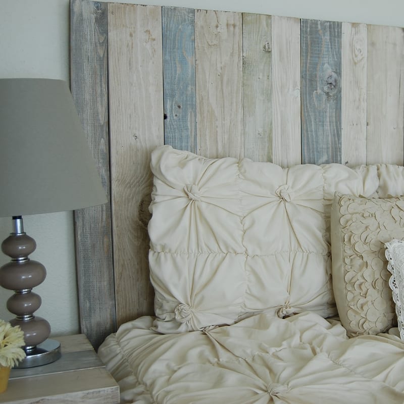 Photo of a beautiful blue, white, and grey farmhouse decor bedroom