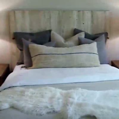  Photo of a headboard with a touch of rustic charm and hints of natural imperfections that can’t be replicated by hand