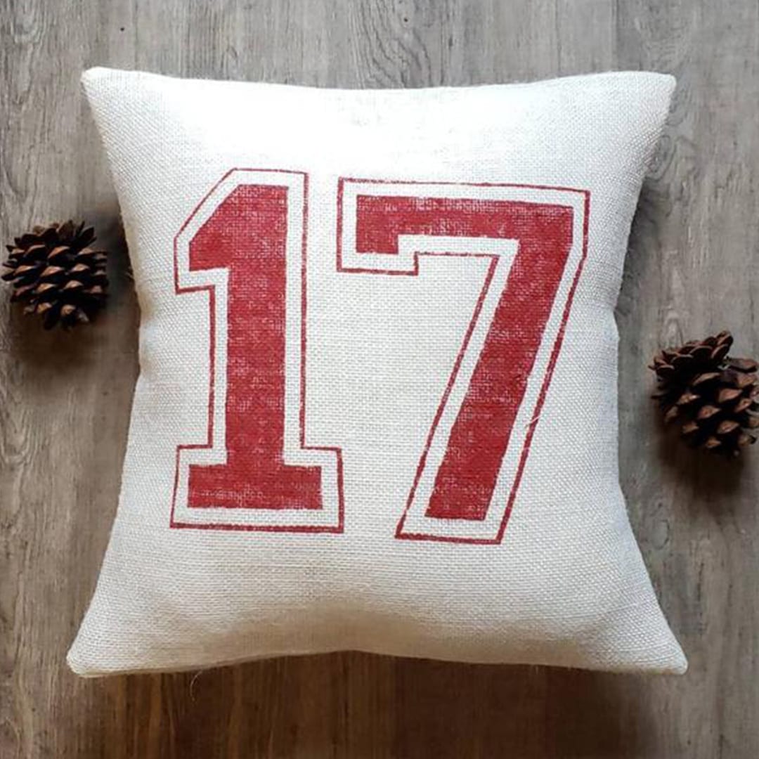 Show some love to your favorite player with a custom throw pillow with their number.
